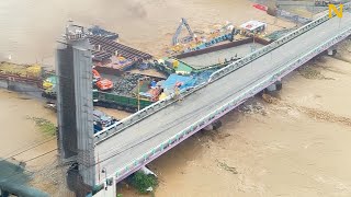 Boats crash into bridge in terrible flood 😰 [upl. by Ymot]