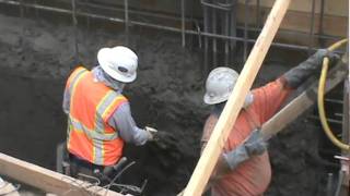 Trimming the Excess Concrete on a Shotcrete Wall [upl. by Storz]